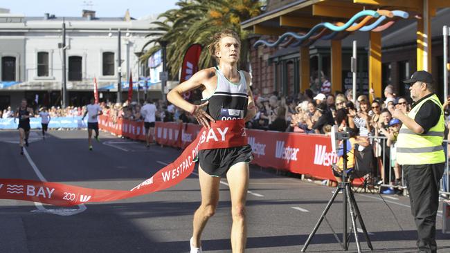 Winner of the 12km Jack Bruce crossing the line. Picture: Dean Martin/AAP