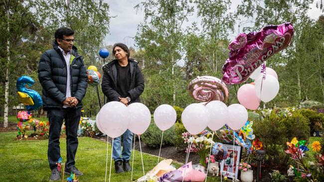 Satya Tarapureddi and Chandra Lanka at their daughter Amrita’s grave. Picture: Jake Nowakowski