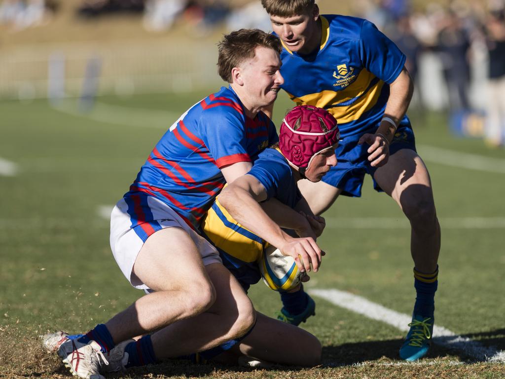 Ben Lots of Downlands tackles Harry Newnham of Grammar.