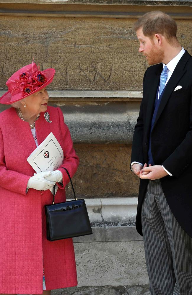 Harry, right, joined his grandmother Queen Elizabeth at St George's Chapel for the wedding of Lady Gabriella Windsor and Thomas Kingston. Picture: AFP