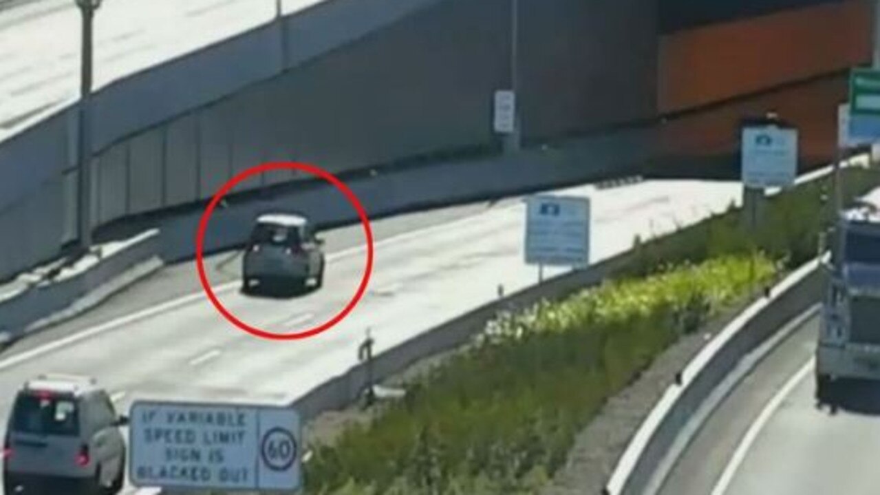 This car begins to slowly reverse out of the tunnel. Picture: Channel 9