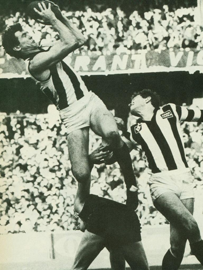 Phil Walsh makes a midair catch in the 1983 season while playing for Collingwood.