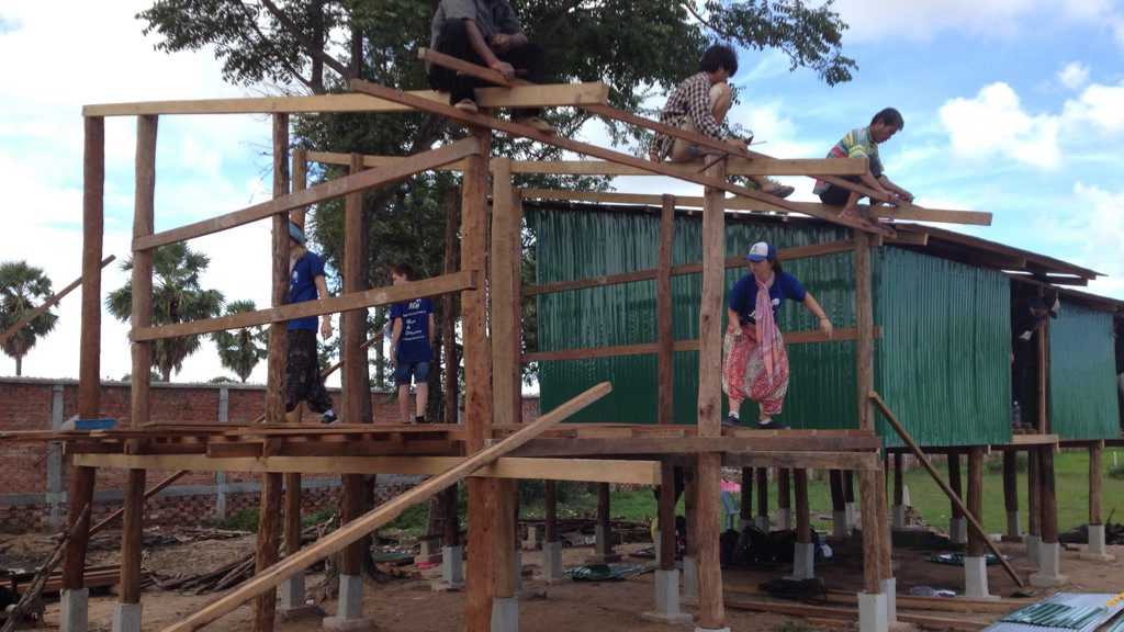 Members of the Dalby PCYC Youth Management Team building houses in Cambodia. Picture: Contributed