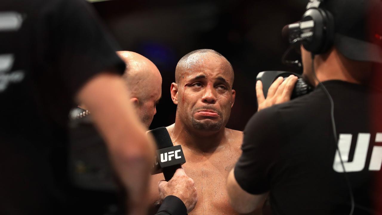 Daniel Cormier reacts to losing to Jon Jones in the Light Heavyweight title bout during UFC 214.