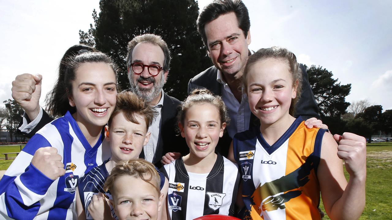 AFL chief executive Gillon McLachlan and Sports Minister Martin Pakula with country football kids Alexandra, Tom, Jaska, Coco and Jasmine. Picture: David Caird