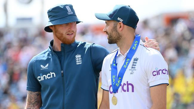 England captain Ben Stokes speaks with man of the match Mark Wood.