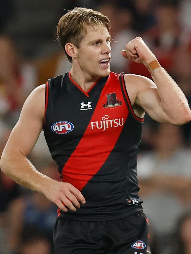 Kaine Baldwin celebrates a goal for the Bombers. Picture: Michael Willson/AFL Photos via Getty Images