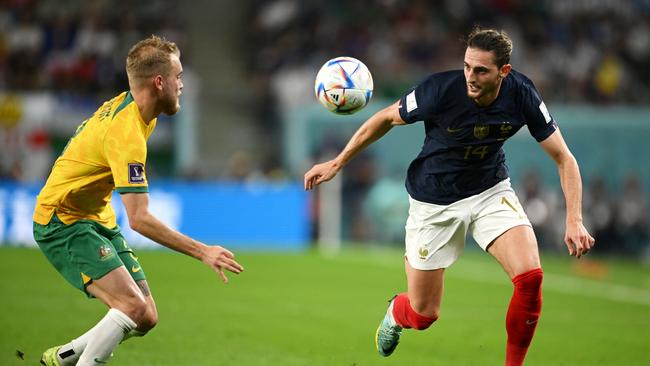 AL WAKRAH, QATAR - NOVEMBER 22: Nathaniel Atkinson of Australia battles for possession with Adrien Rabiot of France during the FIFA World Cup Qatar 2022 Group D match between France and Australia at Al Janoub Stadium on November 22, 2022 in Al Wakrah, Qatar. (Photo by Clive Mason/Getty Images)