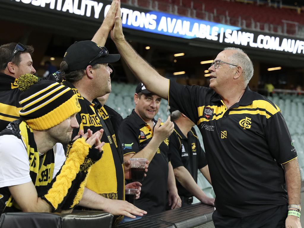 SANFL - PRELIMINARY FINAL - Glenelg v Adelaide Crows at Adelaide Oval. Legendary Glenelg player Peter "Super" Carey high fives fans. Picture SARAH REED