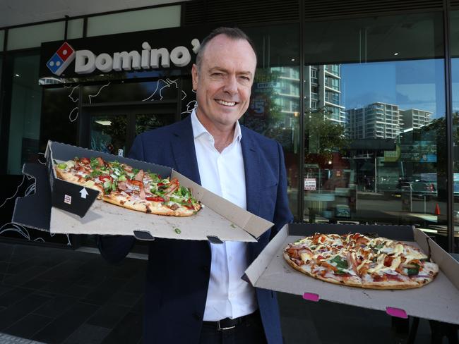 Domino's CEO Don Meij with his company’s pizzas. Picture: Annette Dew