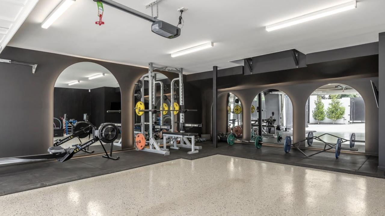 A standout feature, the state-of-the-art home gym reflects Hackett’s commitment to peak performance, complete with high-end training equipment.