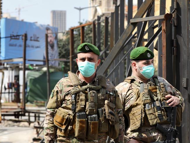 Lebanese soldiers standing guard in the downtown district of the capital Beirut wear protective masks against the coronavirus. Picture: AFP