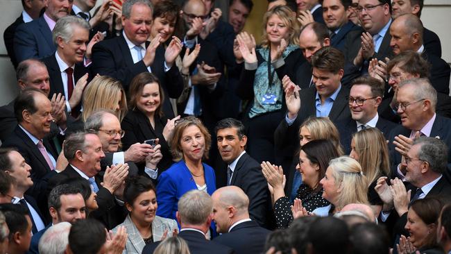 New Conservative Party leader and incoming prime minister Rishi Sunak is greeted by colleagues as he arrives at Conservative Party Headquarters in central London on Monday. 24, 2022. Picture: AFP