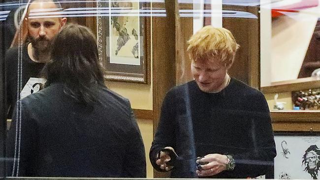 Sheeran got his tattoo on his forearm while Gudinski had his ink put on his bicep. Picture: Media-mode.com