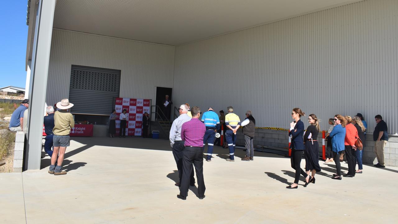 The crowd gathered at the site of the 85 per cent completed pineapple processing factory at Hidden Valley.