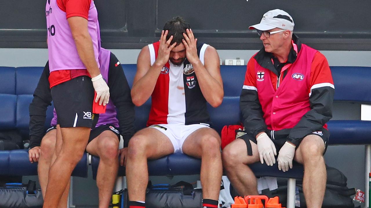Paddy McCartin on the bench with St Kilda doctor Tim Barbour after his most recent concussion.