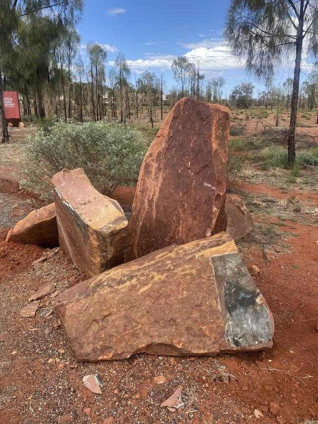 Damaged stone pillar out the front of the Ayers Rock Resort in Yulara