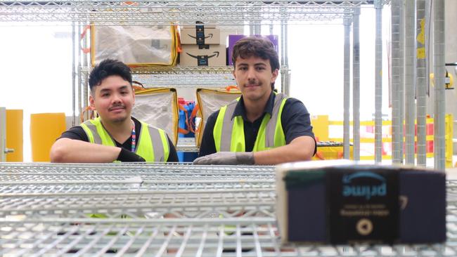 Joshua Gabriel and Arden Cannone are among the new staff to start working at the new Amazon distribution hub at West Gosford. Picture: NewsLocal