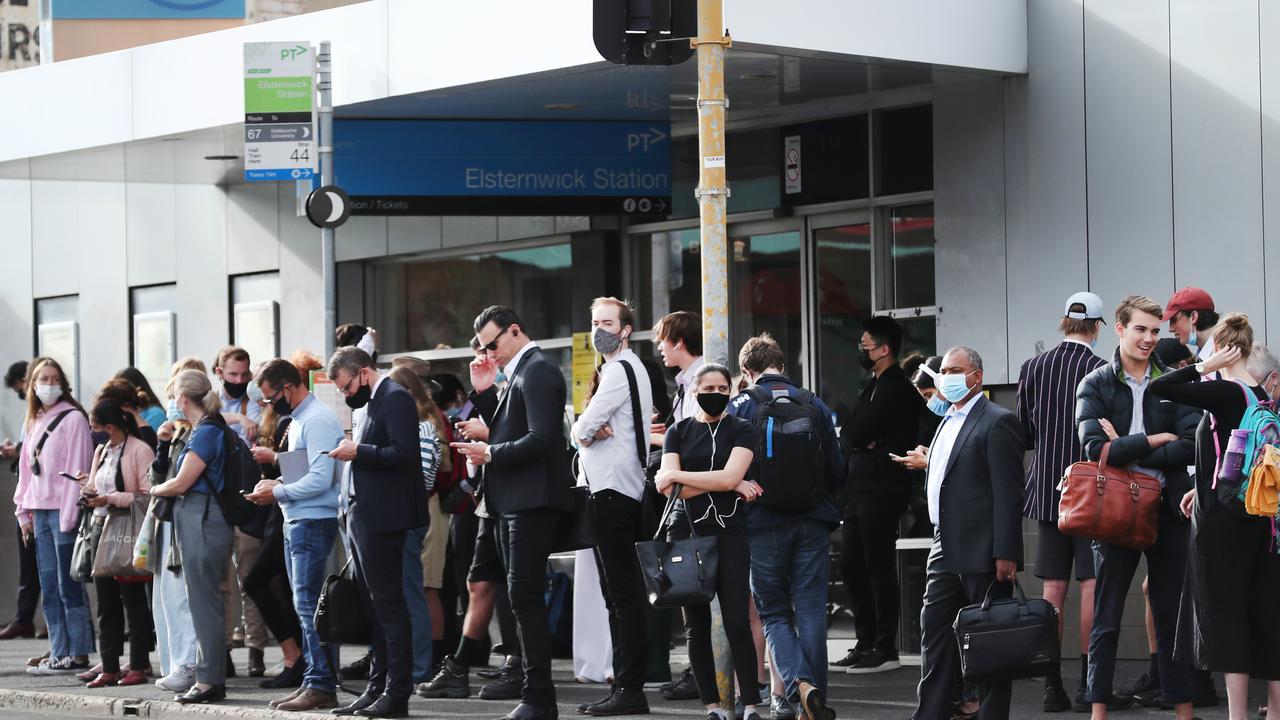 Passengers wait for buses in front of Elsternwick train station after the Sandringham train line was suspended. Picture: NCA NewsWire / David Crosling