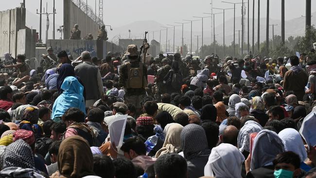 August 20, 2021: One day before Jawid’s family get to the airport, there are growing crowds of Afghans near the military part of the airport in Kabul hoping to flee from the country after the Taliban's military takeover of Afghanistan. Picture: Wakil KOHSAR / AFP)