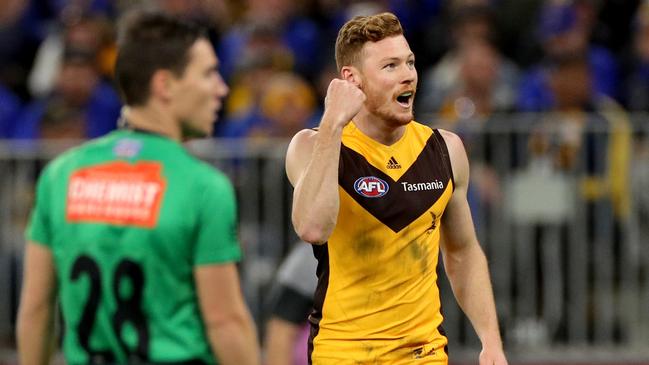 Tim O'Brien celebrates one of his four goals in Hawthorn’s superb win.