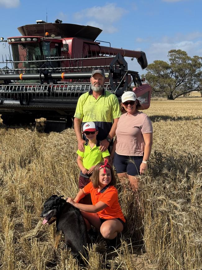 Adam and Kelly Whisson with their children Edee, 9, and Charlie, 6, from Cunderdin, Western Australia, are in the middle of harvest.