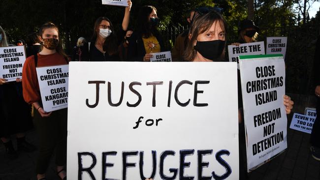 BRISBANE, AUSTRALIA, AUGUST 18, 2020 - Protesters hold signs during a rally before marching through central Brisbane to oppose the expansion/reopening of the Christmas Island detention centre and to call for all refugees and asylum seekers to be released into the community. (NCA NewWire/Dan Peled)