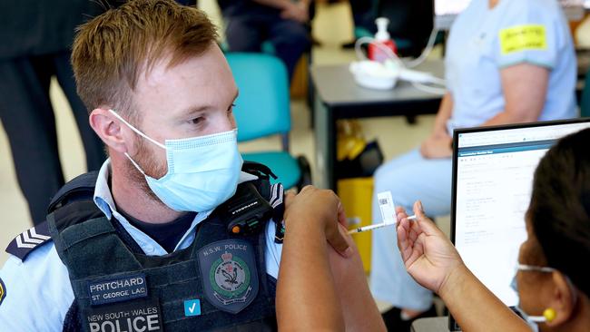 Police officer Lachlan Pritchard gets the Pfizer vaccine at the Royal Prince Alfred Hospital Vaccination Hub in Camperdown. Picture: Toby Zerna