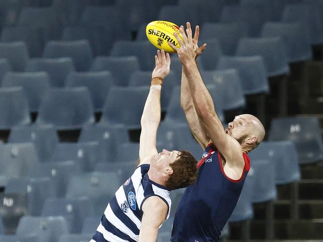 GEELONG, AUSTRALIA - AUGUST 21: Max Gawn of the Demons marks the ball against Gary Rohan of the Cats moments before the final siren during the round 23 AFL match between Geelong Cats and Melbourne Demons at GMHBA Stadium on August 21, 2021 in Geelong, Australia. (Photo by Daniel Pockett/Getty Images)