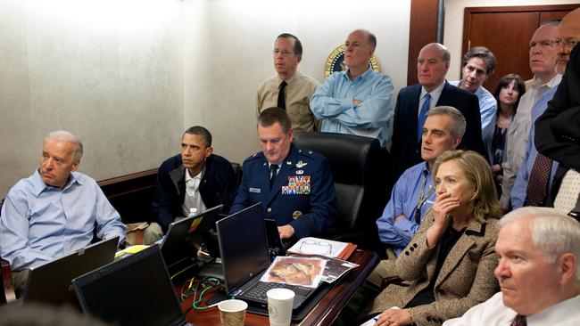 Then US President Barack Obama (2nd L) and Vice President Joe Biden (L), US Secretray of Defense Robert Gates (R) and US Secretary of State Hillary Clinton (2nd R) along with members of the national security team receive an update on the mission against Osama bin Laden in the Situation Room of the White House on May 1, 2011.