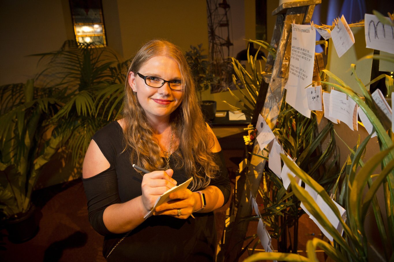 Writing a letter to a stranger is Stevie Bruce in the Garden of Curiosity of the Curious Arts Festival, Saturday, March 16, 2019. Picture: Kevin Farmer