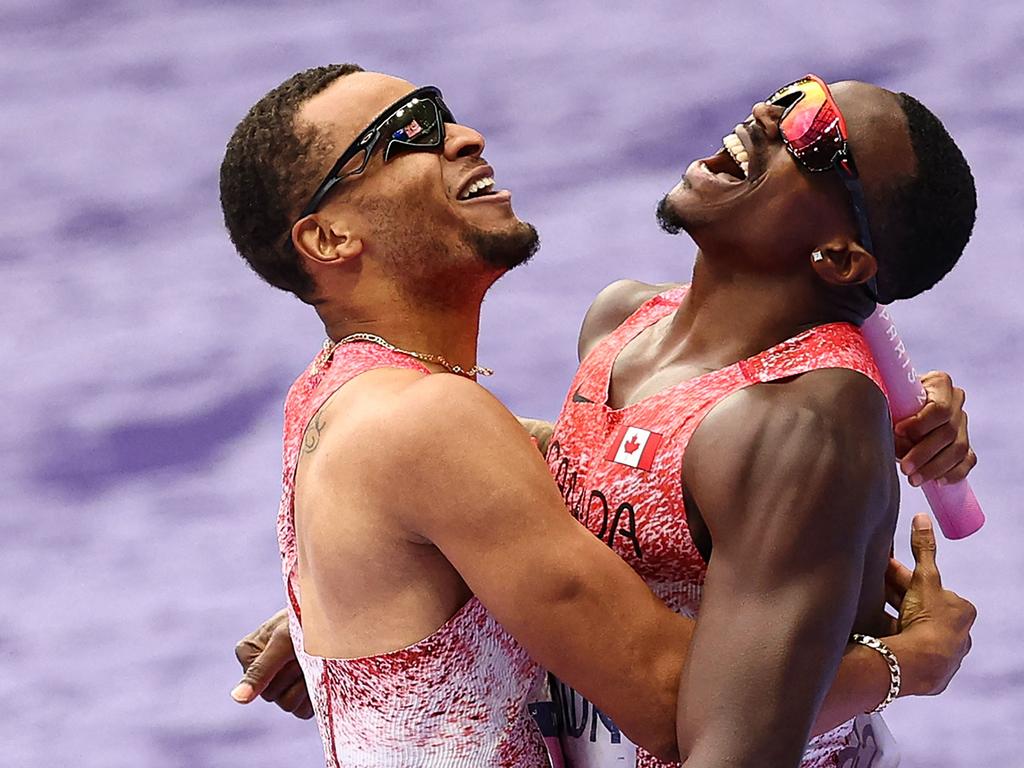 Canada's Andre De Grasse celebrates with Aaron Brown after winning the men's 4x100m relay at the Paris Olympics. Picture: Anne-Christine Poujoulat/ AFP