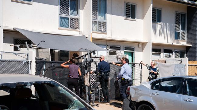 Detectives knocks on doors near the Litchfield Court crime scene. Picture: Pema Tamang Pakhrin