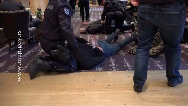 Waters, Arnold and Campbell were brought undone by heavily armed police in the lobby of the Metropol Palace Hotel in Belgrade, Serbia, in January 2018. Picture: Serbian Interior Ministry