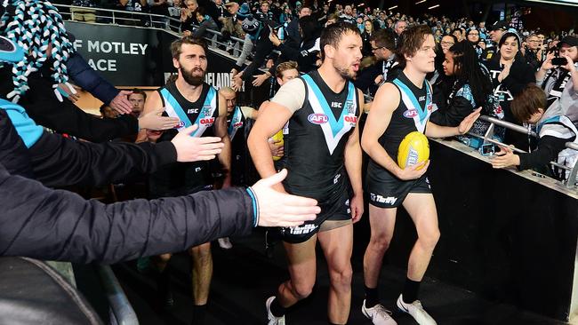 Jared Polec prepares to run out with captain Travis Boak for what was his last game in Port Adelaide colours. Picture: Mark Brake/Getty Images