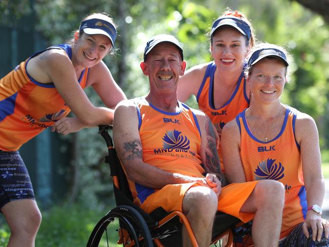 With his three ‘angels’ Genevieve Pattemore, Belinda Neal and Rhiannon Hawkins, Mr Kinsella has completed numerous fun runs and marathons. Picture: Peter Wallis