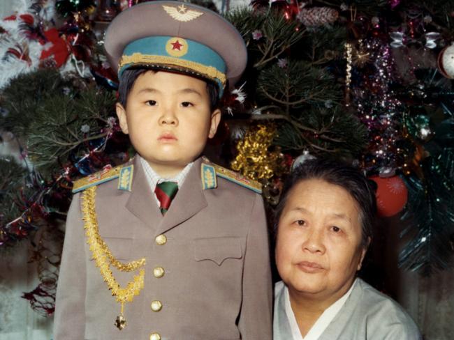 Kim Jong-Nam dressed in an army uniform poses with his maternal grandmother in January 1975 in an unknown place. Picture: AFP PHOTO