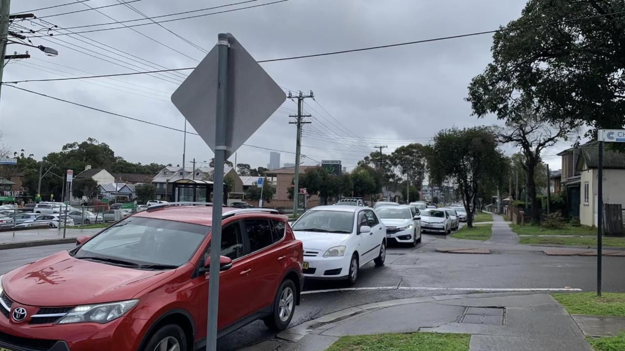 Traffic banks up at Blaxcell St, Granville, blocking Charles St.