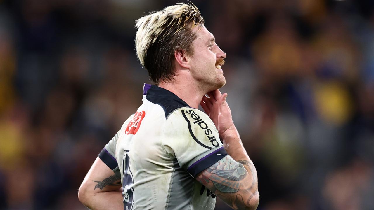 SYDNEY, AUSTRALIA - SEPTEMBER 01: Cameron Munster of the Storm reacts after missing a goal during the round 25 NRL match between the Parramatta Eels and the Melbourne Storm at CommBank Stadium on September 01, 2022, in Sydney, Australia. (Photo by Cameron Spencer/Getty Images)