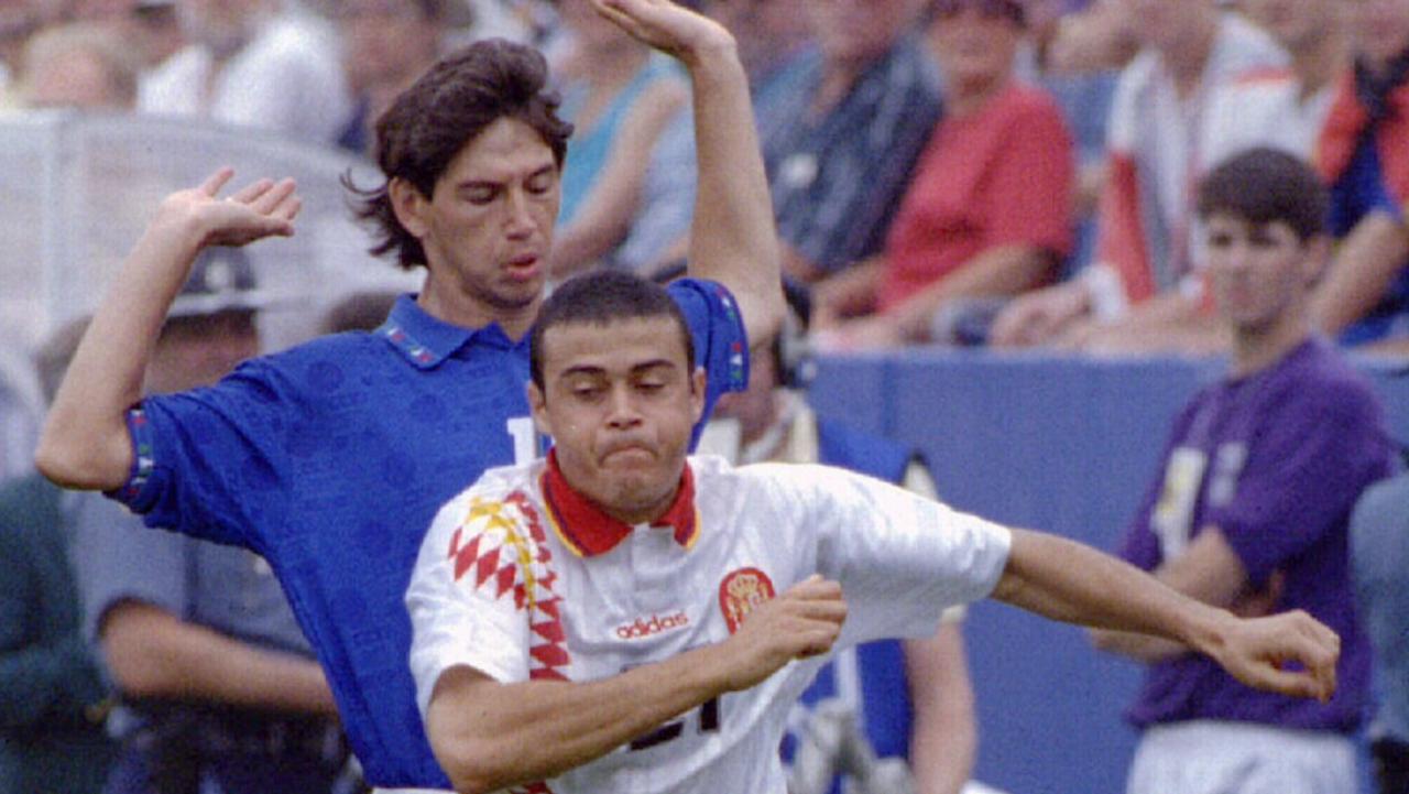 Luis Enrique Martinez (L) of Spain races away with the ball from Demetrio Albertini (Rear) of Italy in early action World Cup. July 1994