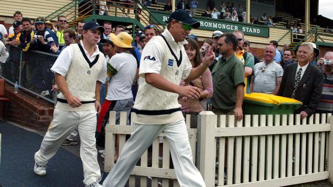 Warne walks out to play for Victoria's 2nd XI. 