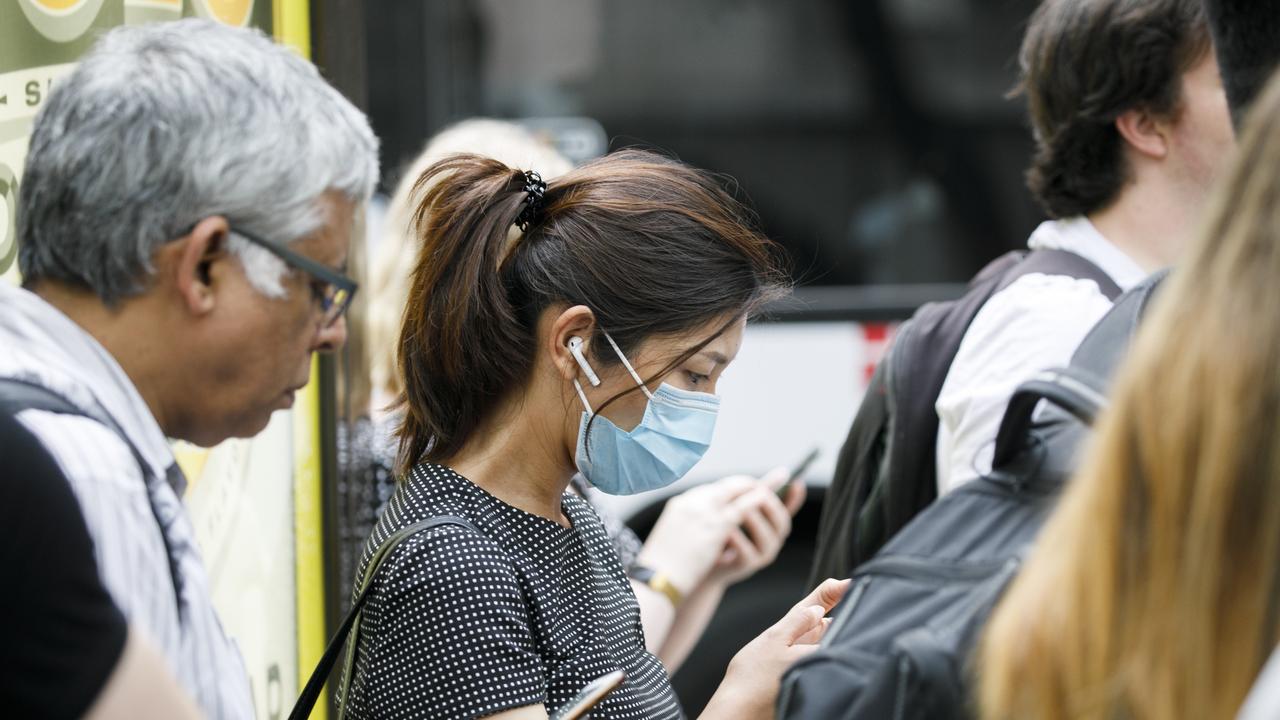 Mask are commonly now being worn around the Sydneys CBD due to the fear of the Coronavirus. Photo: Tim Pascoe