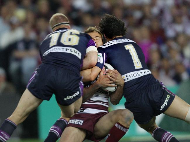 Storm players Michael Crocker and Billy Slater illegally knock Manly fullback Brett Stewart out cold in the 2007 grand final. Picture: NRL