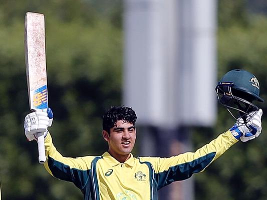 Shobit Singh raises his bat after making a century for Australia’s under-16s. 