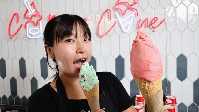 Popular Italian style ice cream store Gelocchio has expanded its Cairns business with a new store on Sheridan Street in Cairns North. Gelocchio store assistant Riko Matsushita serves up two delicious Italian ice cream flavours for the store's first customers. Picture: Brendan Radke