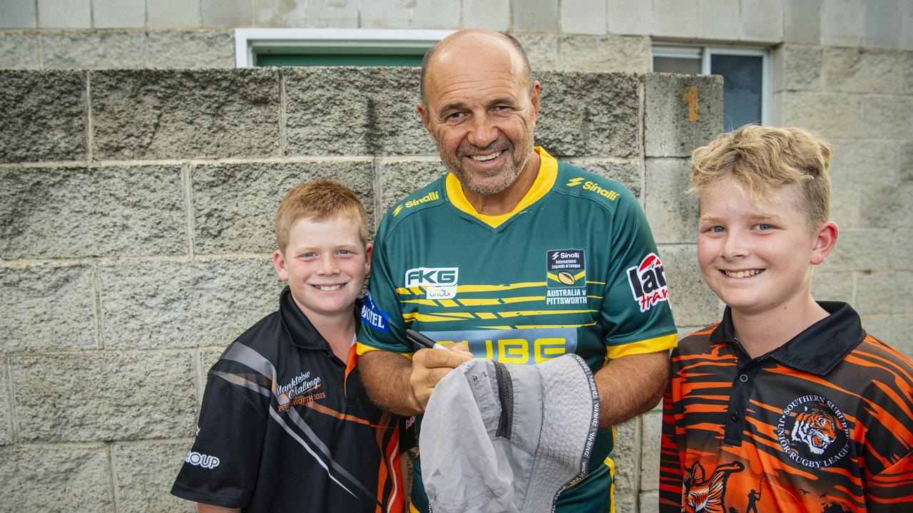 Terry Matterson gives his autograph to Sonny (left) and Harry Ruhle.