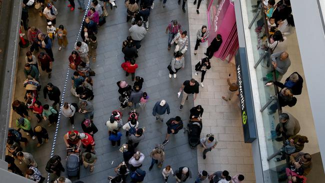 Large crowds wait in the queue outside Chatswood station to use the Sydney Metro northwest. Picture: Toby Zerna