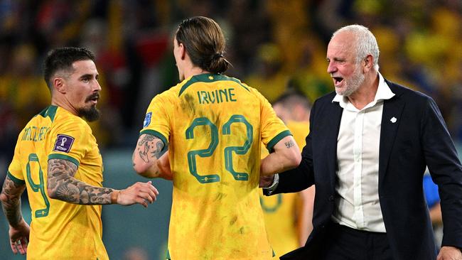 Australian coach Graham Arnold celebrates with Jamie MacLaren and Jackson Irvine after the 1-0 victory over Denmark in the FIFA World Cup in Qatar. Picture: Getty Images