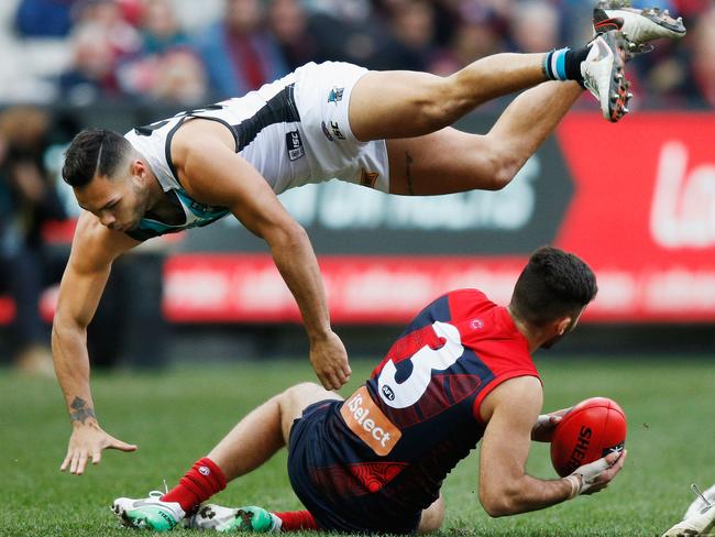 Jarman Impey gets airborne after a collision with Christian Salem.