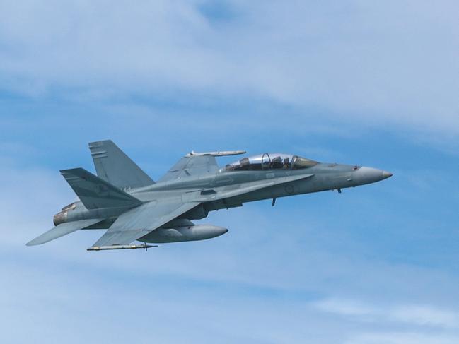 A RAAF F-18 Hornet flys past   during the commemorations of the 79th anniversary of the bombing of Darwin on the 19th of February 1942Picture Glenn Campbell